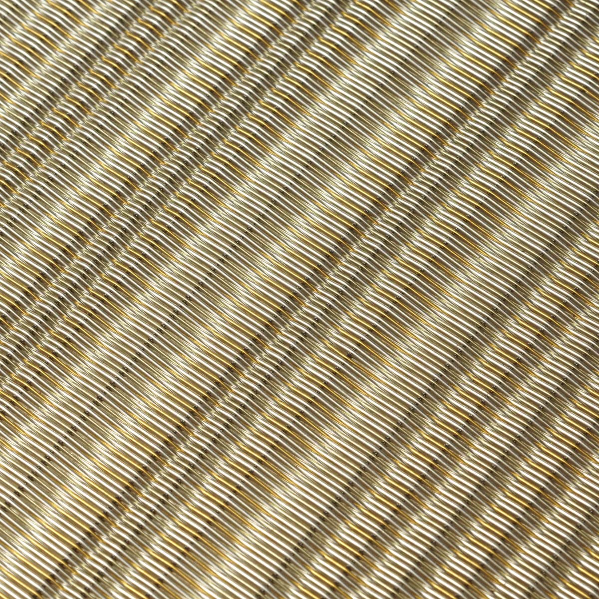 Warm metallic architectural mesh detail used to review brass or copper colour variation and surface character