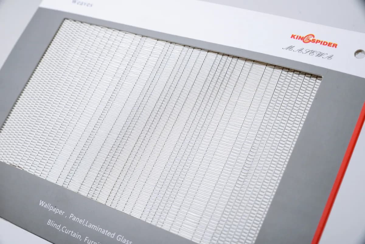 Framed architectural metal mesh sample showing the relationship between mesh field and perimeter edge
