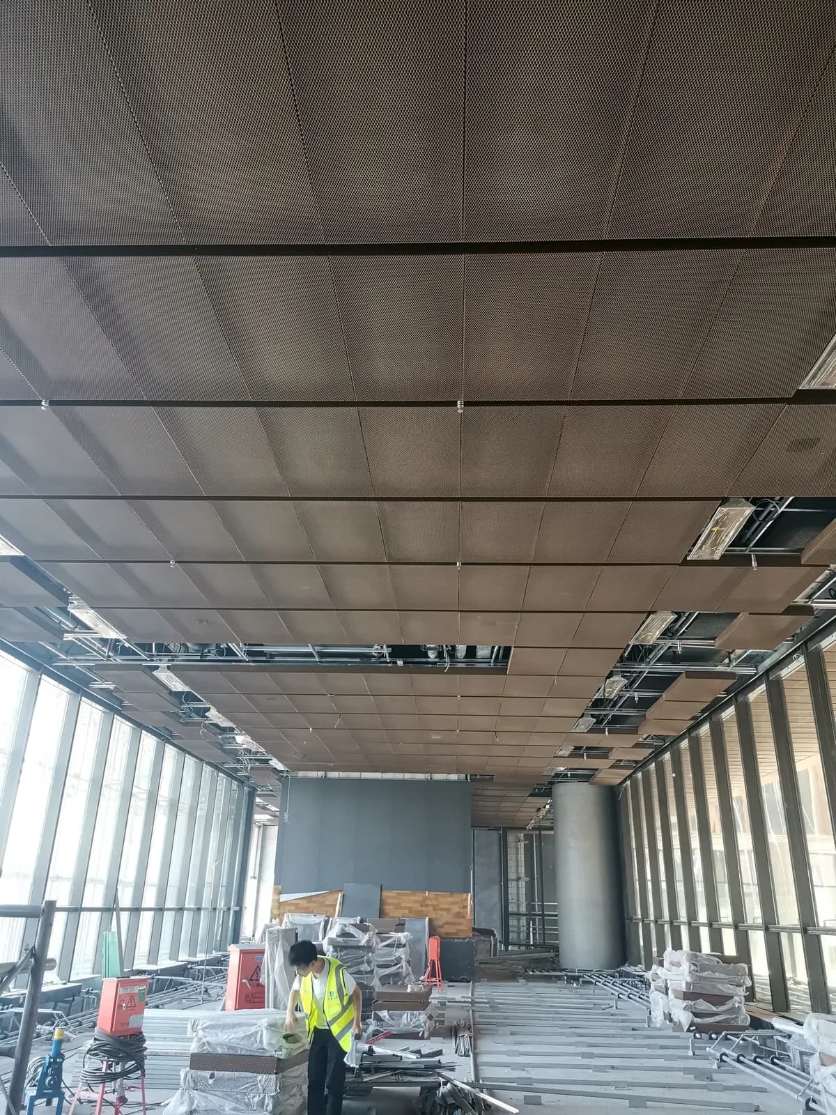 Architectural metal mesh ceiling installation context and surrounding interface